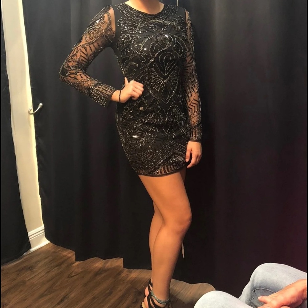 Gorgeous black, lined , short, long sleeves, sequin any special occasion dress.